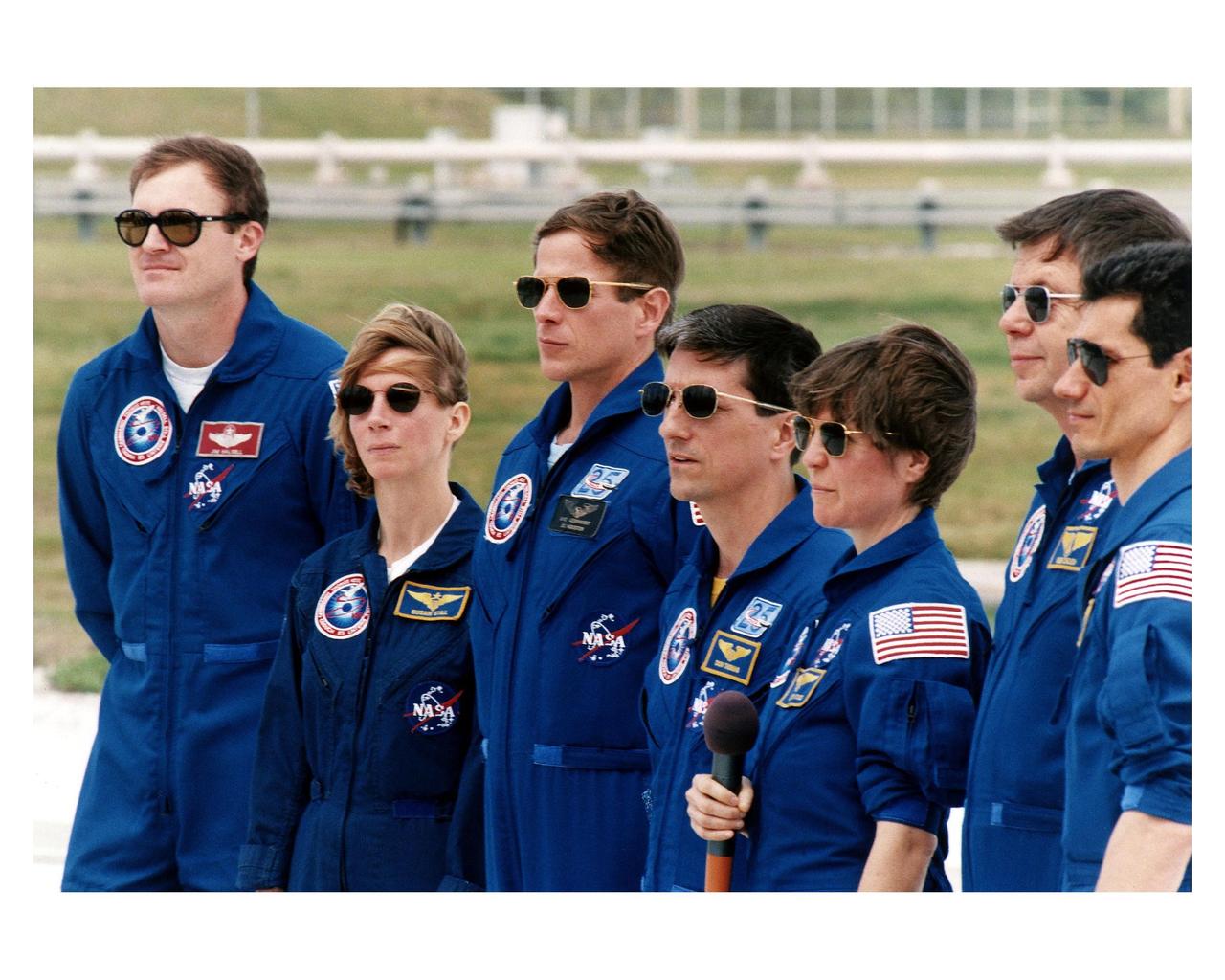 The Space Shuttle Mission STS-83 crew talks to the media at Launch Complex 39A during the crew's <a href="http://www-pao.ksc.nasa.gov/kscpao/release/1997/40-97.htm">Terminal Countdown Demonstration Test (TCDT).</a> From left to right, they are Mission Commander James D. Halsell; Pilot Susan L. Still; Mission Specialists Michael L. Gernhardt, Donald Thomas, and Janice E. Voss (holding microphone); and Payload Specialists Roger K. Crouch and Gregory T. Linteris