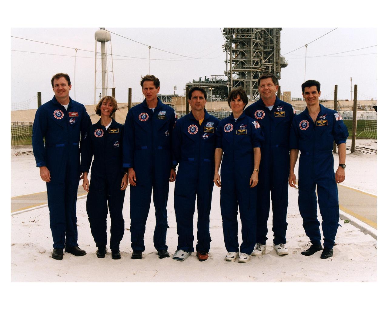 The STS-83 crew poses for the media at Launch Complex 39A during the crew's <a href="http://www-pao.ksc.nasa.gov/kscpao/release/1997/40-97.htm">Terminal Countdown Demonstration Test (TCDT).</a> From left to right, they are Mission Commander James D. Halsell; Pilot Susan L. Still; Mission Specialists Michael L. Gernhardt, Donald Thomas, and Janice E. Voss; and Payload Specialists Roger K. Crouch and Gregory T. Linteris