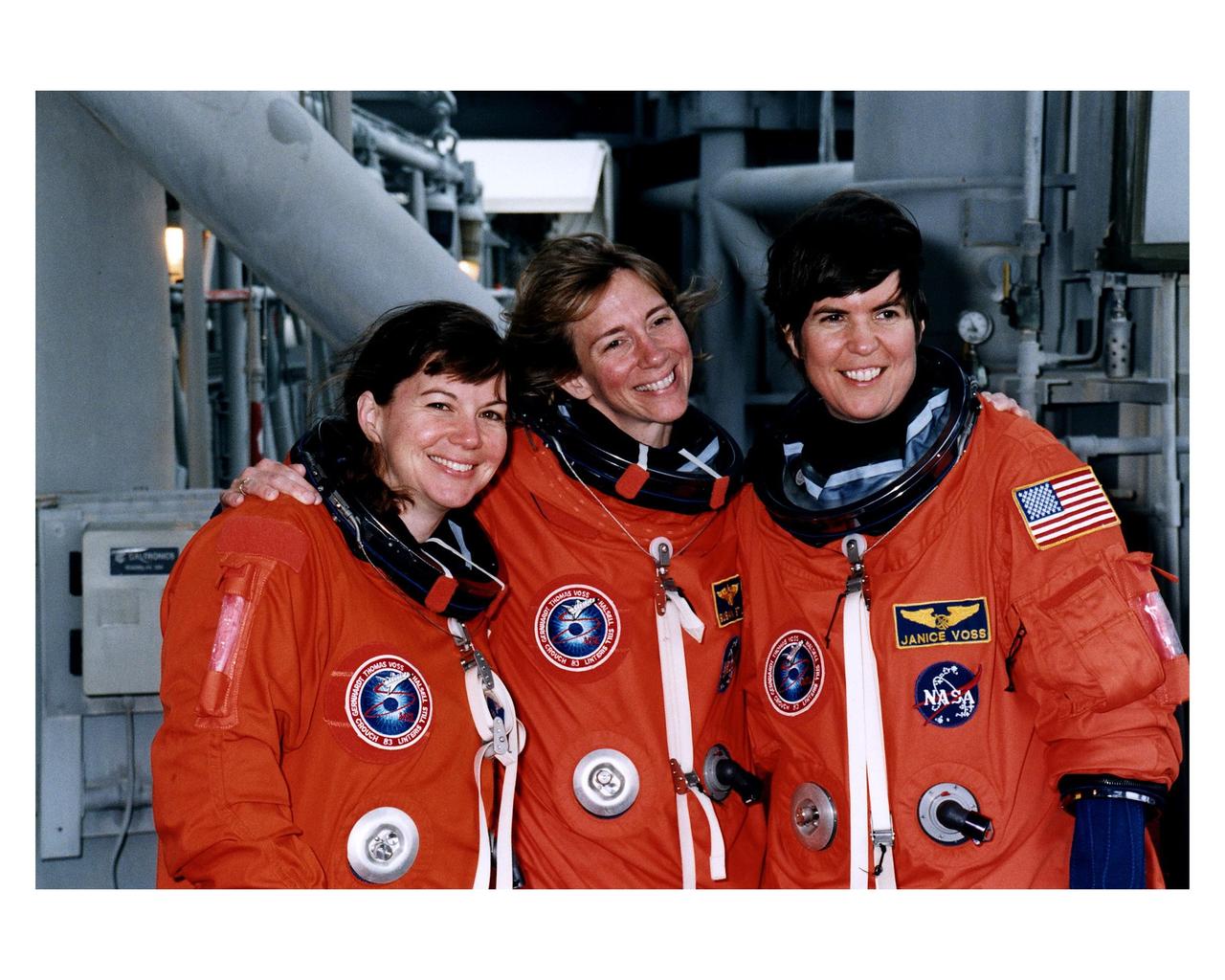STS-83 Alternate Mission Specialist Catherine "Cady" Coleman, Pilot Susan L. Still and Payload Commander Janice Voss mug for the camera at the 195-foot level of Launch Pad 39A during Terminal Countdown Demonstration Test (TCDT) exercises for that mission. The other crew members for the 16-day Microgravity Science Laboratory-1 (MSL-1) mission are Mission Commander James D. Halsell, Jr.; Mission Specialist Donald A. Thomas; Payload Specialist Gregory T. Linteris; Mission Specialist Michael L. Gernhardt; and Payload Specialist Roger K. Crouch