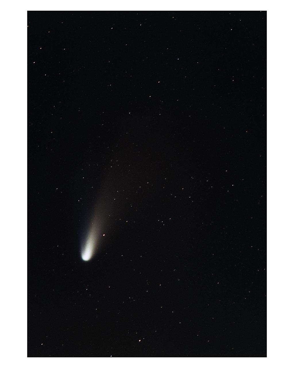 Comet Hale-Bopp is seen in the constellation Lacerta at 5:18 a.m. on March 9, 1997. North is to the left of the comet in this photograph, which was taken on Merritt Island, Florida, near Kennedy Space Center