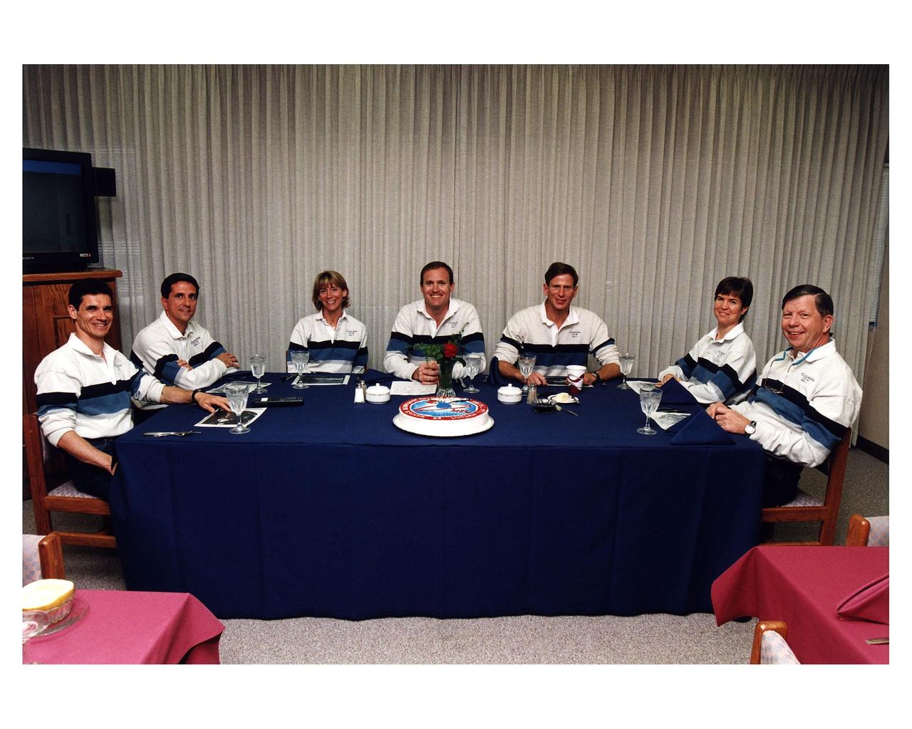 The STS-83 flight crew enjoys the traditional pre-liftoff breakfast in the crew quarters of the Operations and Checkout Building. They are (from left): Payload Specialist Gregory T. Linteris; Mission Specialist Donald A. Thomas; Pilot Susan L. Still; Mission Commander James D. Halsell, Jr.; Mission Specialist Michael L. Gernhardt; Payload Commander Janice E. Voss; and Payload Specialist Roger K. Crouch. After a weather briefing, the flight crew will be fitted with their launch/entry suits and depart for Launch Pad 39A. Once there, they will take their positions in the crew cabin of the Space Shuttle Columbia to await a liftoff during a window that will open at 2:00 p.m. EST, April 4