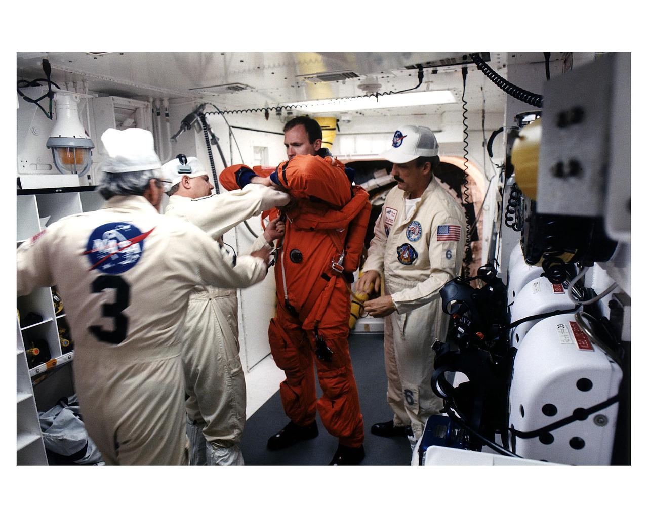STS-83 crew member in the white room at Launch Pad 39A prior to entering the crew compartment of Columbia for launc