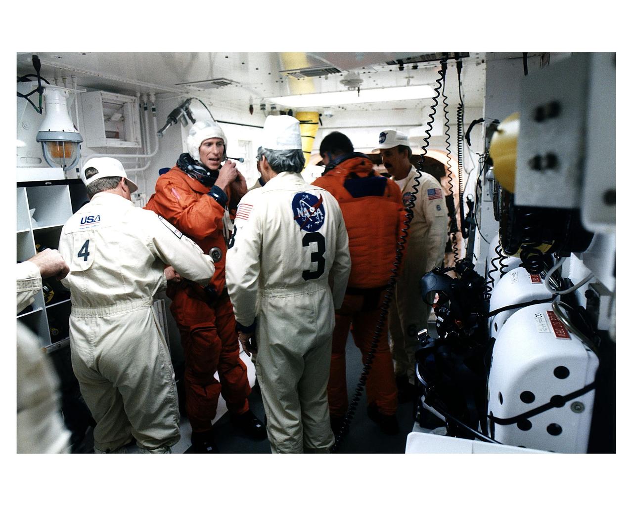 STS-83 crew member in the white room at Launch Pad 39A prior to entering the crew compartment of Columbia for launc