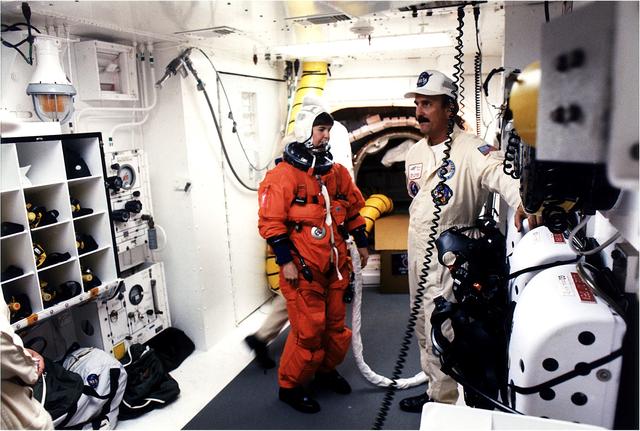 NASA image: KENNEDY SPACE CENTER, FLA. - STS-83 Payload Commander Janice E. Voss prepares to enter the Space Shuttle Columbia at Launch Pad 39A after getting assistance from the White Room closeout crew that included Bob Saulnier (right).