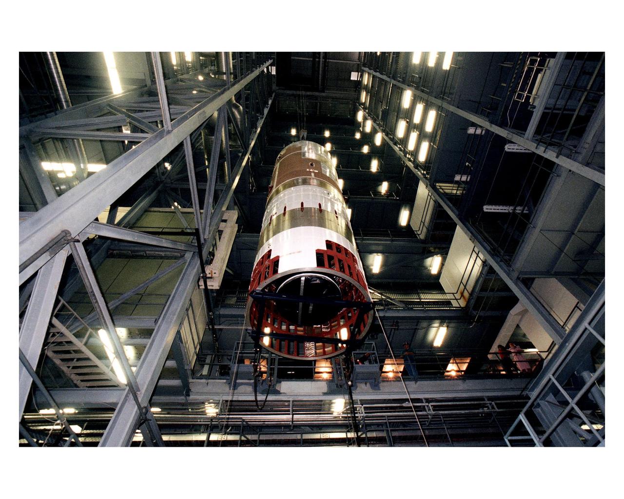 The second stage of a Titan IV/Centaur expendable launch vehicle is suspended in the Vertical Integration Building before being moved into position for mating to the first stage. The Titan IVB rocket is the newest version of America's most powerful unmanned rocket. This rocket will be used for the Cassini mission to Saturn. The Cassini launch is targeted for October 6 from Launch Complex 40, Cape Canaveral Air Station