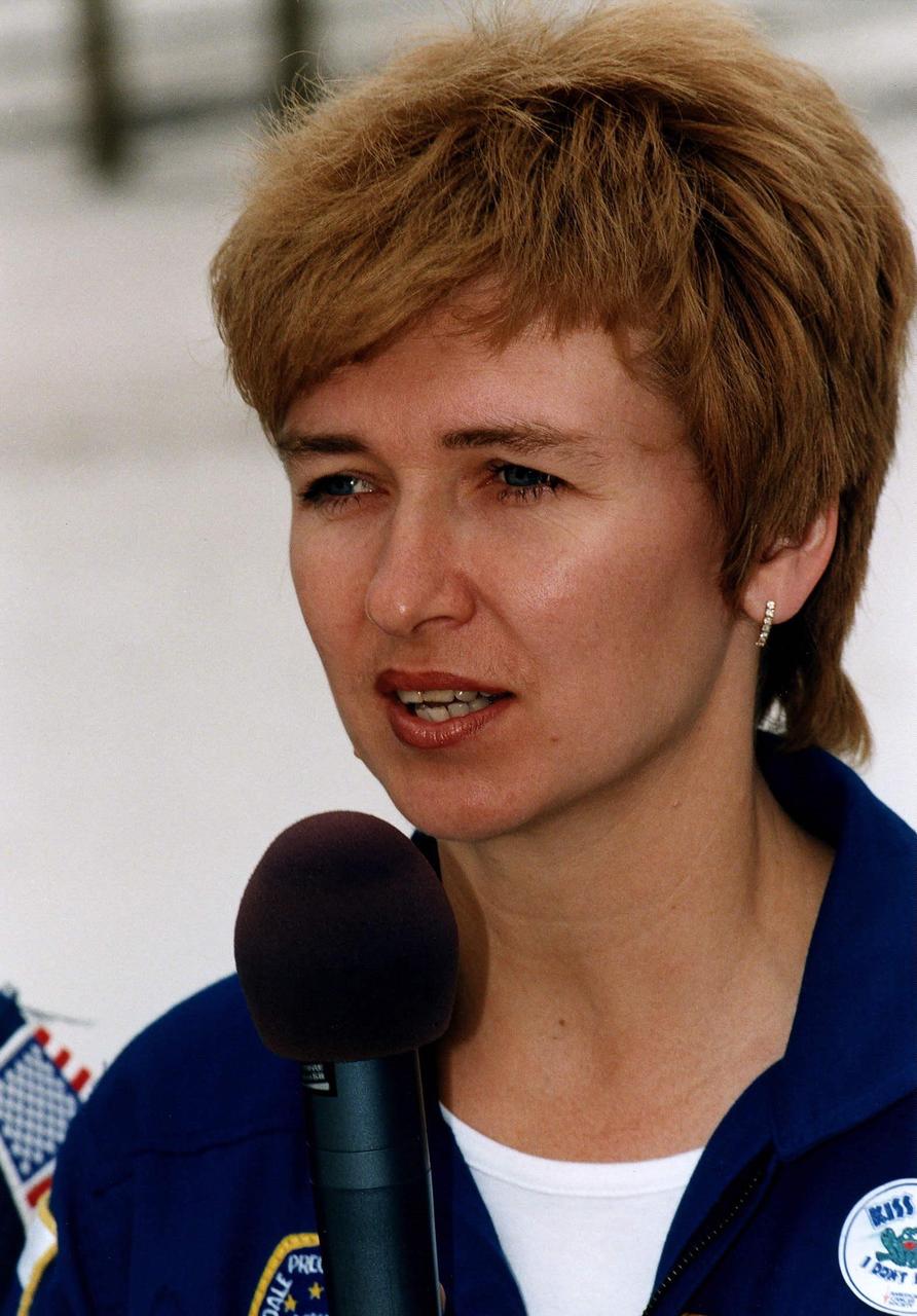 STS-84 Mission Specialist Elena V. Kondakova, a cosmonaut with the Russian Space Agency, talks to news media representatives and other onlookers during Terminal Countdown Demonstration Test (TCDT) activities at Launch Pad 39A. Kondakova will be one of seven crew members on the sixth docking of the Space Shuttle with the Russian Space Station Mir. Another of the crew members, C. Michael Foale, will transfer to the space station and become a member of the Mir 23 crew, replacing U.S. astronaut Jerry M. Linenger, who will return to Earth aboard Atlantis. Foale will live and work on Mir until mid-September when his replacement is expected to arrive on the STS-86 mission. Kondakova previously lived on the Russian space station as the flight engineer of the 17th main mission on Mir from Oct. 4, 1994, to March 9, 1995. STS-84 is targeted for a May 15 liftoff