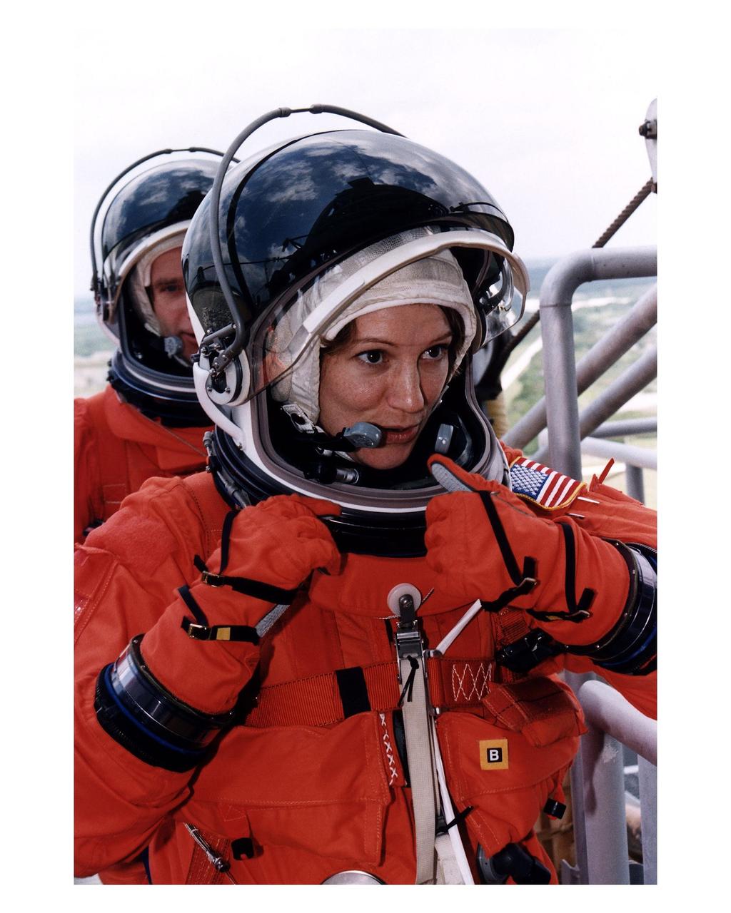 STS-84 Pilot Eileen Marie Collins participates in Terminal Countdown Demonstration Test (TCDT) activities at Launch Pad 39A. Behind her is Commander Charles J. Precourt. TCDT is a dress rehearsal for the launch, which is scheduled May 15. STS-84 aboard Atlantis will be the sixth docking of the Space Shuttle with the Russian Space Station Mir. After docking, STS-84 Mission Specialist C. Michael Foale will transfer to the space station and become a member of the Mir 23 crew, replacing U.S. astronaut Jerry M. Linenger, who will return to Earth aboard Atlantis. Foale will live and work on Mir until mid-September when his replacement is expected to arrive on the STS-86 mission