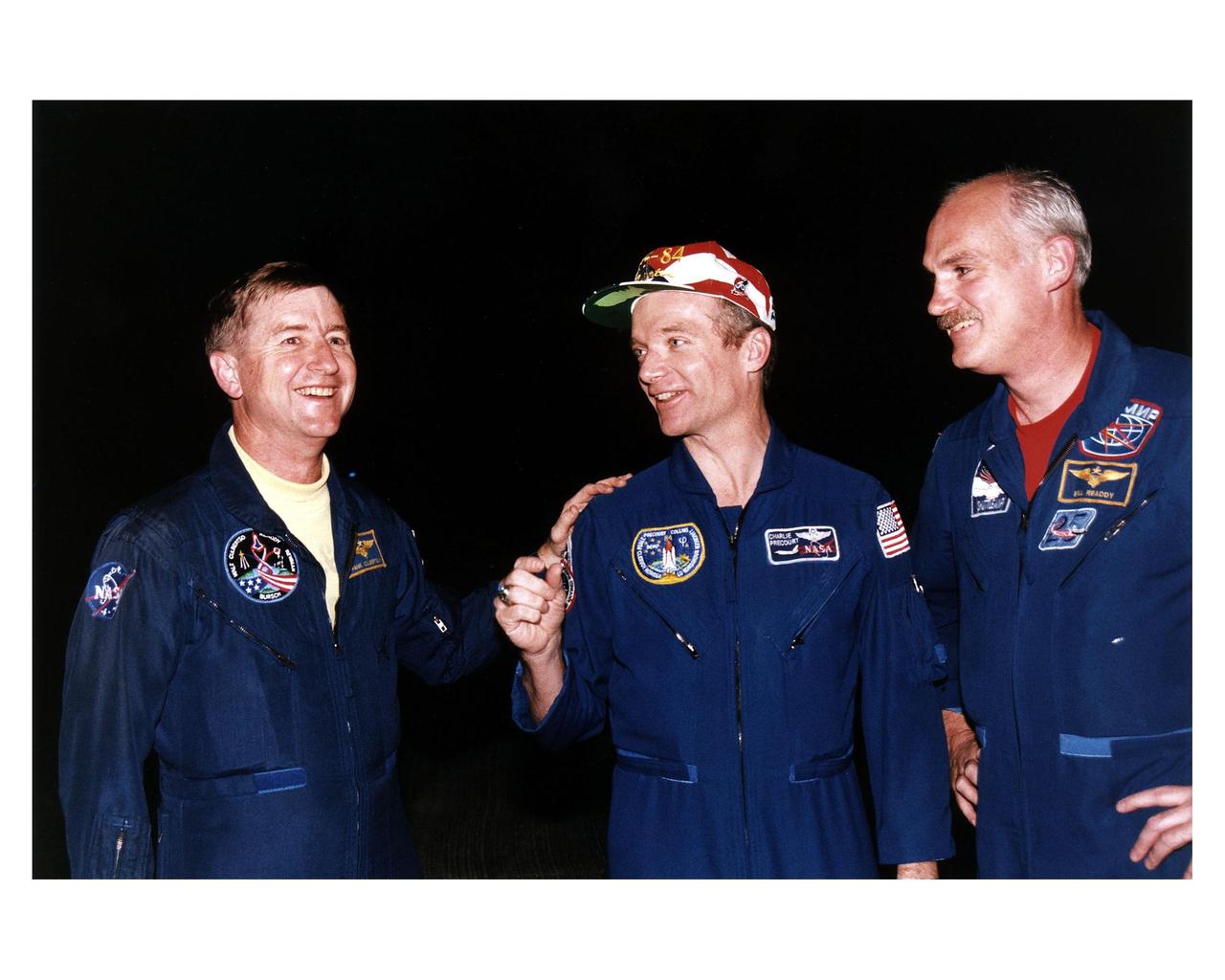 STS-84 Commander Charles J. Precourt talks with fellow astronauts Frank Culbertson, at left, and William F. Readdy after their arrival at KSC’s Shuttle Landing Facilty. Culbertson, NASA director of the Phase One Program of the International Space Station, and Readdy, manager, program development, in the Space Shuttle Program Office at Johnson Space Center, were the pilots of T-38 jets which brought STS-84 crew members to KSC for the launch. Culbertson’s passenger was STS-84 Mission Specialist Carlos I. Noriega; Readdy’s passenger was Mission Specialist C. Michael Foale. Liftoff of Space Shuttle Mission STS-84 is scheduled May 15. STS-84 will be the sixth docking of the Space Shuttle with the Russian Space Station Mir. During the docking, Foale will transfer to the Russian space station to become a member of the Mir 23 crew, replacing U.S. astronaut Jerry M. Linenger, who will return to Earth on Atlantis. Foale is scheduled to remain on Mir about four months until his replacement arrives on STS-86 in September