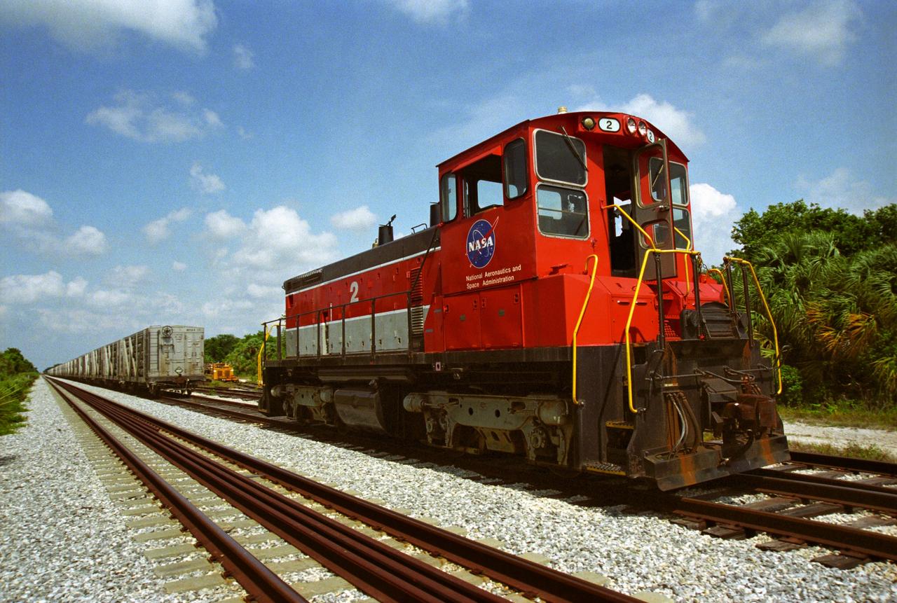 CAPE CANAVERAL, Fla. – A NASA railroad train moves along the track at NASA's Kennedy Space Center in Florida. The space agency utilizes railroad operations to not only move equipment at Kennedy, but to transport hardware to and from contractor facilities across the nation. Photo credit: NASA