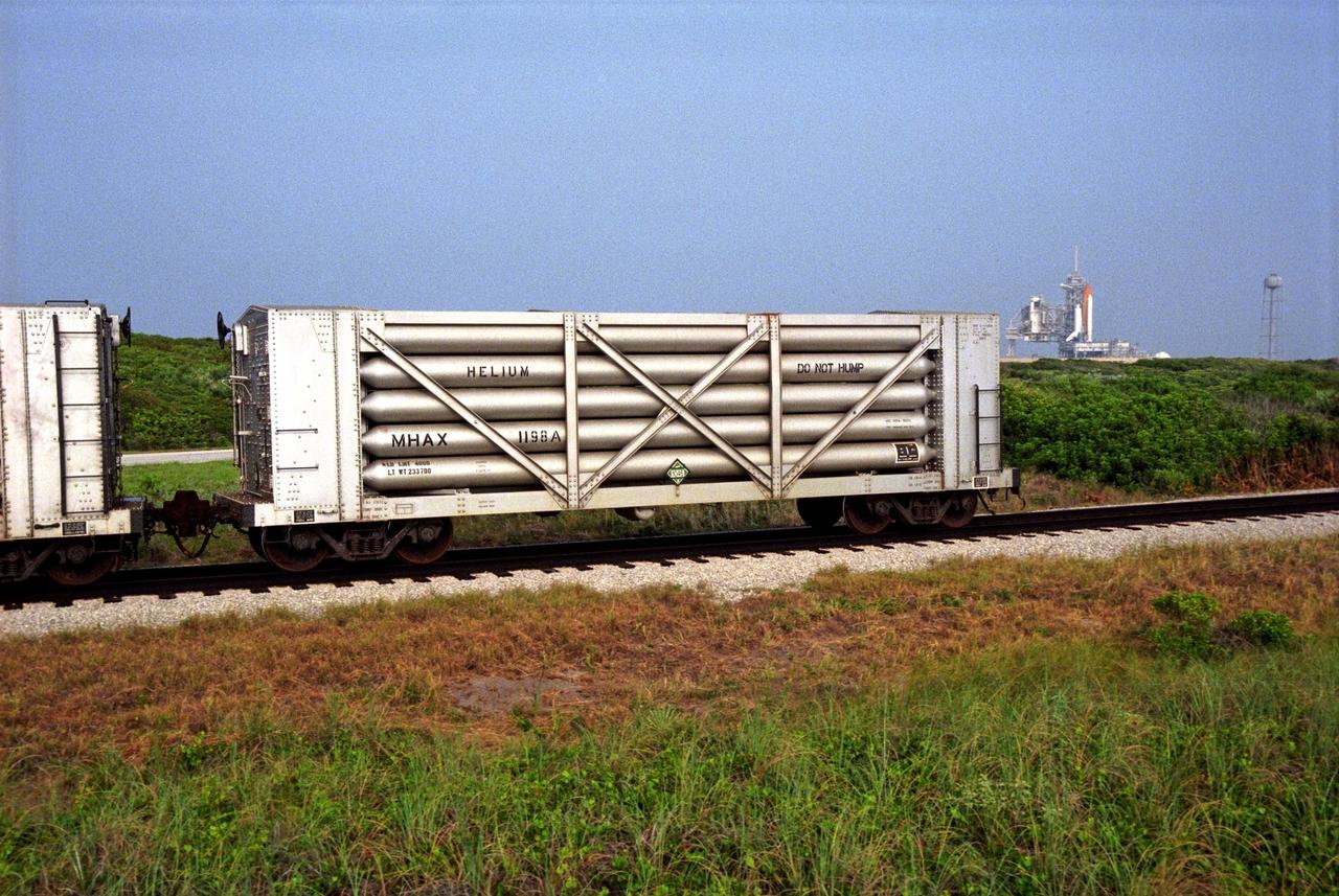 A NASA railroad train moves past Launch Pad 39A at NASA's Kennedy Space Center in Florida. The space agency utilizes railroad operations to not only move equipment at Kennedy, but to transport hardware to and from contractor facilities across the nation. Photo credit: NASA