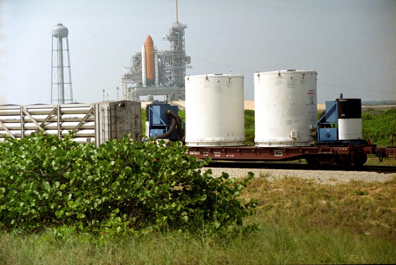 CAPE CANAVERAL, Fla. – A NASA railroad train moves past Launch Pad 39A at NASA's Kennedy Space Center in Florida. The space agency utilizes railroad operations to not only move equipment at Kennedy, but to transport hardware to and from contractor facilities across the nation. Photo credit: NASA