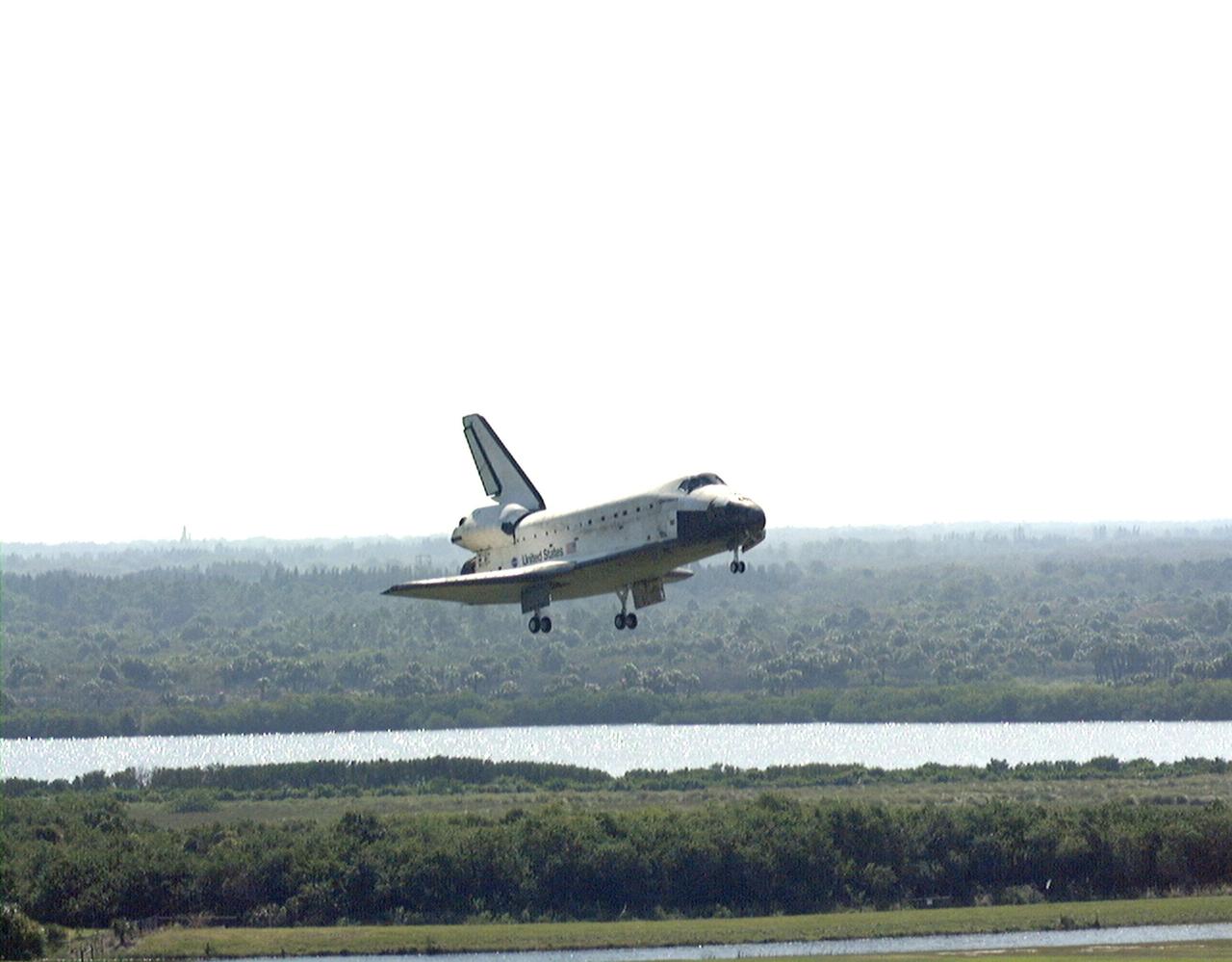 Orbiter Discovery approaches runway 33 at the Shuttle Landing Facility after a successful 3.6-million-mile voyage on mission STS-95