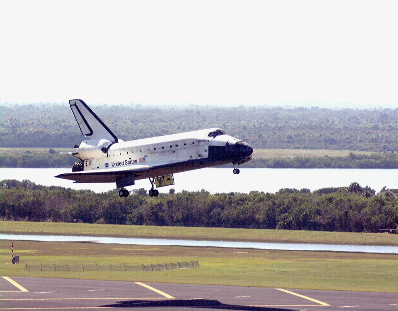 Orbiter Discovery approaches runway 33 at the Shuttle Landing Facility after a successful 3.6-million-mile voyage on mission STS-95