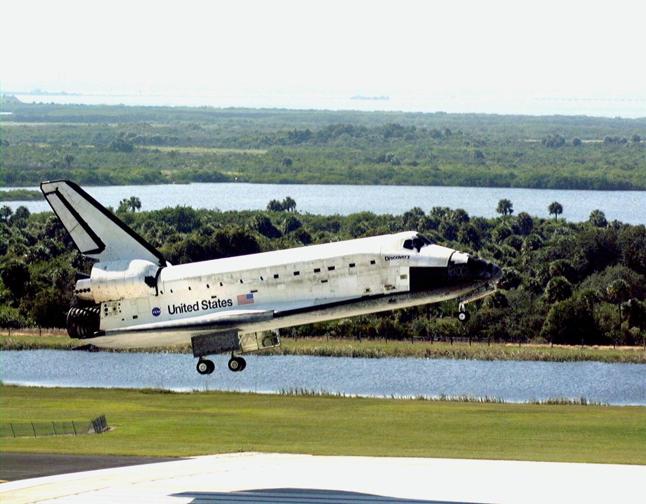 Orbiter Discovery gets ready to land on runway 33 at the Shuttle Landing Facility after a successful 3.6-million-mile voyage on mission STS-95