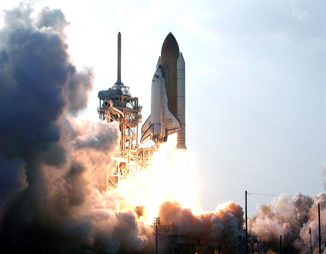 KENNEDY SPACE CENTER,  Fla. -- With more than seven million pounds of thrust, the Space Shuttle Discovery lifts off from Launch Pad 39A at 6:06:24 p.m. EDT June 2 on its way to the Mir space station. On board Discovery are Mission Commander Charles J. Precourt; Pilot Dominic L. Gorie; and Mission Specialists Wendy B. Lawrence, Franklin R. Chang-Diaz, Janet Lynn Kavandi and Valery Victorovitch Ryumin. The nearly 10-day mission will feature the ninth and final Shuttle docking with the Russian space station Mir, the first Mir docking for the Space Shuttle orbiter Discovery, the first on-orbit test of the Alpha Magnetic Spectrometer (AMS), and the first flight of the new Space Shuttle super lightweight external tank. Astronaut Andrew S. W. Thomas will be returning to Earth as a STS-91 crew member after living more than four months aboard Mir