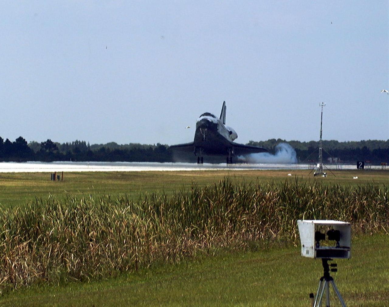 KENNEDY SPACE CENTER, FLA. -- The orbiter Discovery touches down on Runway 15 of KSC's Shuttle Landing Facility to complete the STS-91 mission. Main gear touchdown was at 2:00:18 p.m. EDT on June 12, 1998, landing on orbit 155 of the mission. The wheels stopped at 2:01:22 p.m. EDT, for a total mission-elapsed time of 9 days, 19 hours, 55 minutes and 1 second. The 91st Shuttle mission was the 44th KSC landing in the history of the Space Shuttle program and the 15th consecutive landing at KSC. During the mission, the orbiter docked with the Russian space station Mir for the ninth time, concluding Phase I of the joint U.S.-Russian International Space Station Program. STS-91 also featured first flights for both the Alpha Magnetic Spectrometer and the Space Shuttle super lightweight external tank. The STS-91 flight crew included Mission Commander Charles J. Precourt; Pilot Dominic L. Gorie; and Mission Specialists Wendy B. Lawrence, Franklin R. Chang-Diaz, Janet Lynn Kavandi and Valery Victorovitch Ryumin of the Russian Space Agency. Astronaut Andrew S. W. Thomas also returned to Earth from Mir as an STS-91 crew member after 141 days in space