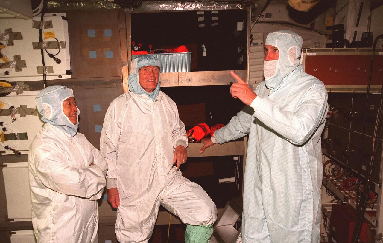 (Left to right) STS-95 Payload Specialists Chiaki Mukai, with the National Space Development Agency of Japan, and John H. Glenn Jr., senator from Ohio, and Mission Commander Curtis L. Brown Jr. take part in middeck orientation during a Crew Equipment Interface Test (CEIT) in the Orbiter Processing Facility Bay 2. The CEIT gives astronauts an opportunity for a hands-on look at the payloads on which they will be working on orbit. The launch of the STS-95 mission, aboard Space Shuttle Discovery, is scheduled for Oct. 29, 1998. The mission includes research payloads such as the Spartan solar-observing deployable spacecraft, the Hubble Space Telescope Orbital Systems Test Platform, the International Extreme Ultraviolet Hitchhiker, as well as the SPACEHAB single module with experiments on space flight and the aging process