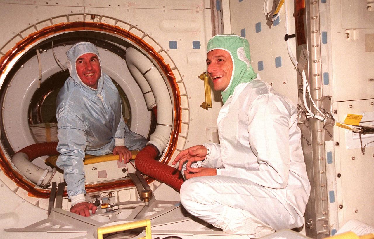 STS-95 Mission Specialists Stephen Robinson and Pedro Duque, with the European Space Agency, take part in a Crew Equipment Interface Test (CEIT) for their mission. The CEIT gives astronauts an opportunity for a hands-on look at the payloads on whcih they will be working on orbit. The launch of the STS-95 mission, aboard Space Shuttle Discovery, is scheduled for Oct. 29, 1998. The mission includes research payloads such as the Spartan solar-observing deployable spacecraft, the Hubble Space Telescope Orbital Systems Test Platform, the International Extreme Ultraviolet Hitchhiker, as well as the SPACEHAB single module with experiments on space flight and the aging process