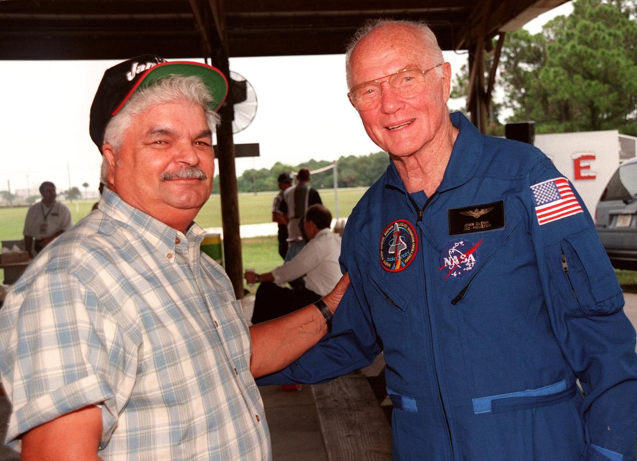 During a break in the Crew Equipment Interface Test (CEIT), Payload Specialist John H. Glenn Jr., a senator from Ohio, greets Bobby Miranda. Miranda was a NASA photographer for Glenn's first flight on Friendship 7, February 1962. The CEIT gives astronauts an opportunity for a hands-on look at the payloads and equipment with which they will be working on orbit. The launch of the STS-95 mission is scheduled for Oct. 29, 1998, on the Space Shuttle Discovery. The mission includes research payloads such as the Spartan solar-observing deployable spacecraft, the Hubble Space Telescope Orbital Systems Test Platform, the International Extreme Ultraviolet Hitchhiker, as well as the SPACEHAB single module with experiments on space flight and the aging process