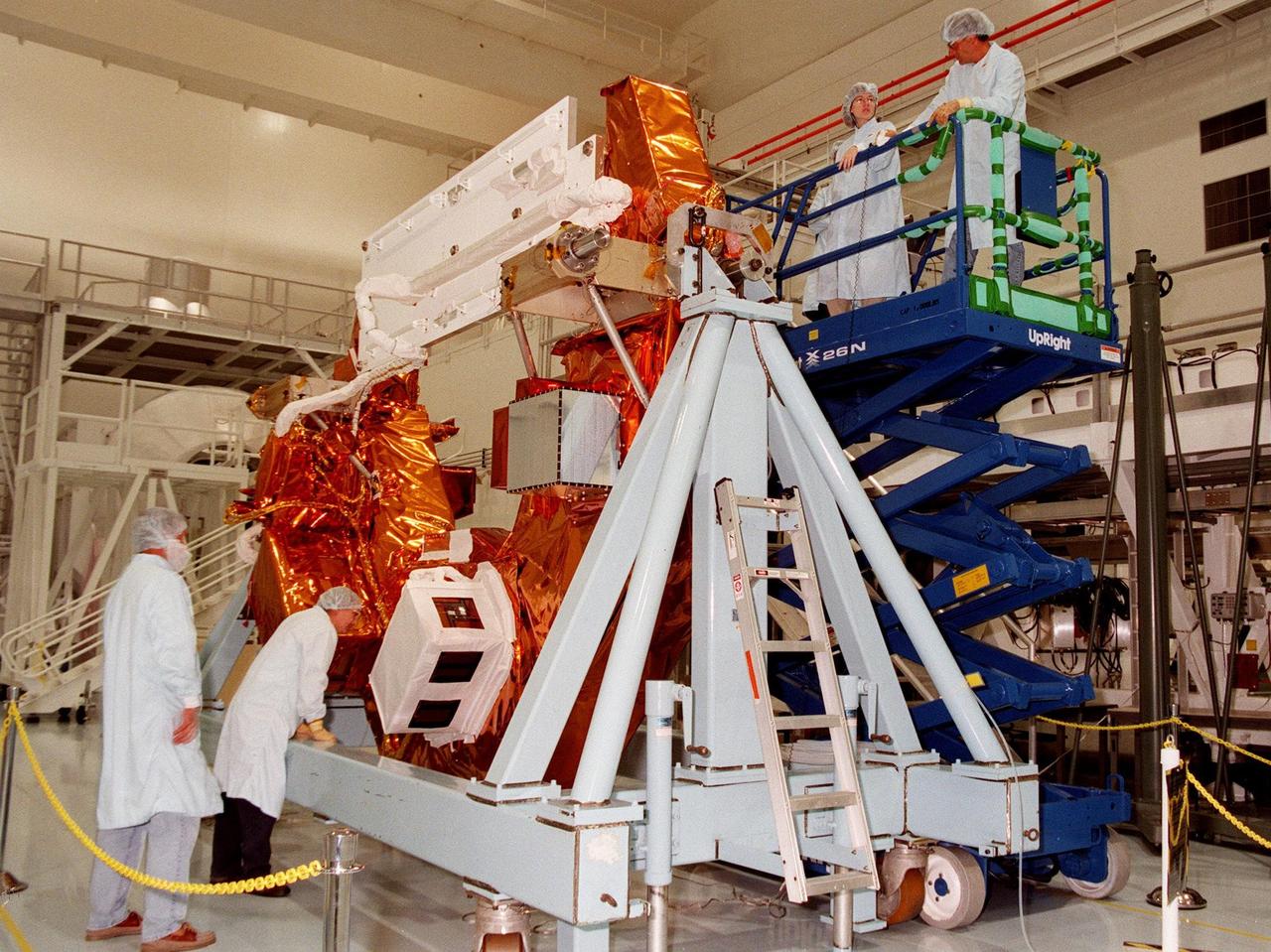 KENNEDY SPACE CENTER, FLA. -- The Hubble Space Telescope Orbiting Systems Test (HOST) is checked out by technicians in the Space Shuttle Processing Facility. One of the payloads on the STS-95 mission, the HOST platform is carrying four experiments to validate components planned for installation during the third Hubble Space Telescope servicing mission and to evaluate new technologies in an earth orbiting environment. The STS-95 mission is scheduled to launch Oct. 29. It will carry three other payloads: the Spartan solar-observing deployable spacecraft, the International Extreme Ultraviolet Hitchhiker, and the SPACEHAB single module with experiments on space flight and the aging process