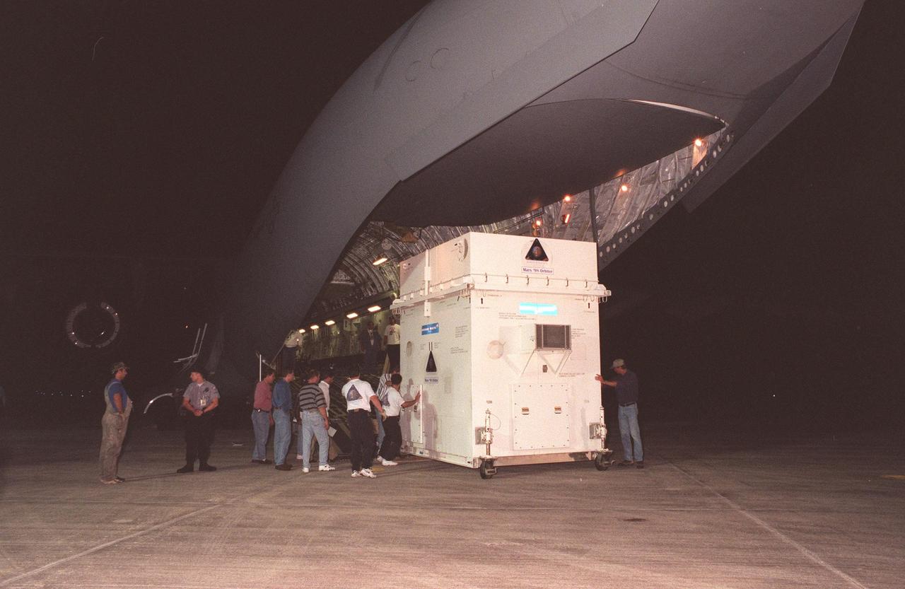 The Mars Climate Orbiter spacecraft arrives at KSC's Shuttle Landing Facility aboard an Air Force C-17 cargo plane early this morning following its flight from the Lockheed Martin Astronautics plant in Denver, Colo. When the spacecraft arrives at the red planet, it will primarily support its companion Mars Polar Lander spacecraft, planned for launch on Jan. 3, 1999. After that, the Mars Climate Orbiter's instruments will monitor the Martian atmosphere and image the planet's surface on a daily basis for one Martian year (1.8 Earth years). It will observe the appearance and movement of atmospheric dust and water vapor, as well as characterize seasonal changes on the surface. The detailed images of the surface features will provide important clues to the planet's early climate history and give scientists more information about possible liquid water reserves beneath the surface. The scheduled launch date for the Mars Climate Orbiter is Dec. 10, 1998, on a Delta II 7425 rocket