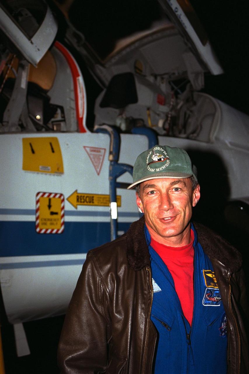 STS-89 Commander Terrence Wilcutt poses in front of his T-38 jet trainer after landing with other members of the flight crew at KSC’s Shuttle Landing Facility from NASA’s Johnson Space Center to begin Terminal Countdown Demonstration Test (TCDT) activities. The TCDT is held at KSC prior to each Space Shuttle flight to provide crews with the opportunity to participate in simulated countdown activities. Endeavour is targeted for launch of STS-89 on Jan. 22 at 9:48 p.m. EST, which will be the first mission of 1998 and the eighth to dock with Russia’s Mir Space Station. The STS-89 mission is scheduled to last nine days