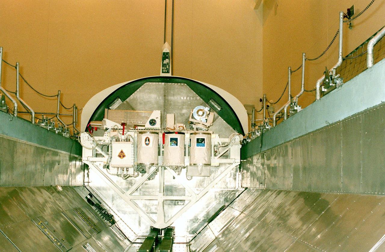 KENNEDY SPACE CENTER, FLA. -- The International Extreme Ultraviolet Hitchhiker (IEH-3), one of the payloads for the STS-95 mission, is moved to a payload canister in the Multi-Payload Processing Facility. The mission is scheduled for liftoff on Space Shuttle Discovery on Oct. 29. IEH-3 comprises several experiments that will study the Jovian planetary system, hot stars, planetary and reflection nebulae, other stellar objects and their environments through remote observation of EUV/FUV emissions; study spacecraft interactions, Shuttle glow, thruster firings, and contamination; and measure the solar constant and identify variations in the value during a solar cycle. Other research payloads include the Hubble Space Telescope Orbital Systems Test Platform, the Spartan solar-observing deployable spacecraft, and the SPACEHAB single module with experiments on space flight and the aging process