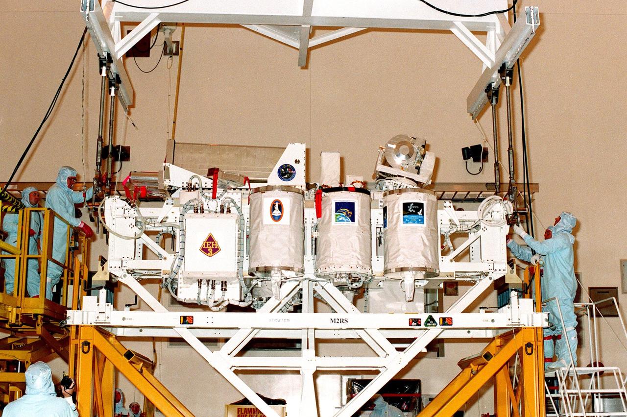 KENNEDY SPACE CENTER, FLA. -- The International Extreme Ultraviolet Hitchhiker (IEH-3), one of the payloads for the STS-95 mission, is prepared for its move to a payload canister in the Multi-Payload Processing Facility. The mission is scheduled for liftoff on Space Shuttle Discovery on Oct. 29. IEH-3 comprises several experiments that will study the Jovian planetary system, hot stars, planetary and reflection nebulae, other stellar objects and their environments through remote observation of EUV/FUV emissions; study spacecraft interactions, Shuttle glow, thruster firings, and contamination; and measure the solar constant and identify variations in the value during a solar cycle. Other research payloads include the Hubble Space Telescope Orbital Systems Test Platform, the Spartan solar-observing deployable spacecraft, and the SPACEHAB single module with experiments on space flight and the aging process