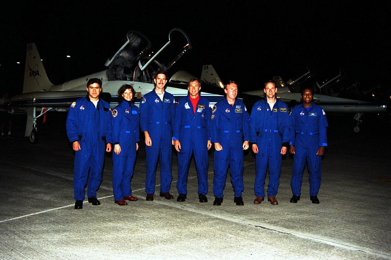 The STS-89 crew pose at Kennedy Space Center’s (KSC’s) Shuttle Landing Facility after flying in from NASA’s Johnson Space Center to begin Terminal Countdown Demonstration Test (TCDT) activities. The TCDT is held at KSC prior to each Space Shuttle flight to provide crews with the opportunity to participate in simulated countdown activities. Endeavour is targeted for launch of STS-89 on Jan. 22 at 9:48 p.m. EST. From left to right are Mission Specialists Salizhan Sharipov, of the Russian Space Agency, Bonnie Dunbar, Ph.D., and James Reilly, Ph.D.; Commander Terrence Wilcutt; Mission Specialist Andrew Thomas, Ph.D.; Pilot Joe Edwards Jr.; and Mission Specialist Michael Anderson. Mission STS-89 will be the first mission of 1998 and the eighth to dock with Russia’s Mir Space Station, where Thomas will succeed David Wolf, M.D., who has been on Mir since September 28. The STS-89 mission is scheduled to last nine days