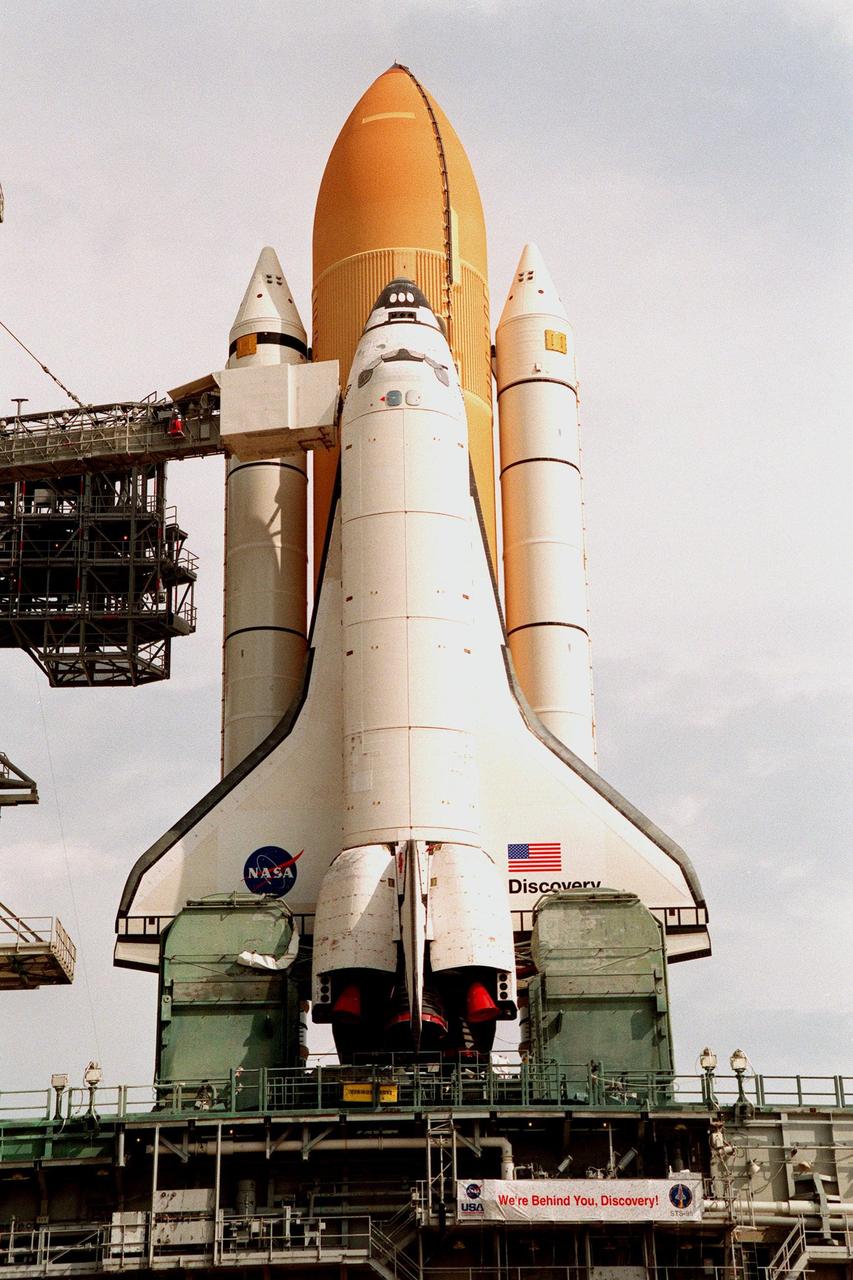 This close-up of the Space Shuttle Discovery shows it atop the Mobile Launch Platform on Launch Pad 39-B, with the "white room" still extended, awaiting rollback decision. KSC managers developed a precautionary plan to roll back Discovery to the Vehicle Assembly Building in the event that Hurricane Georges threatens Central Florida. The decision was made in order to minimize risk and provide protection to the Space Shuttle, a national asset