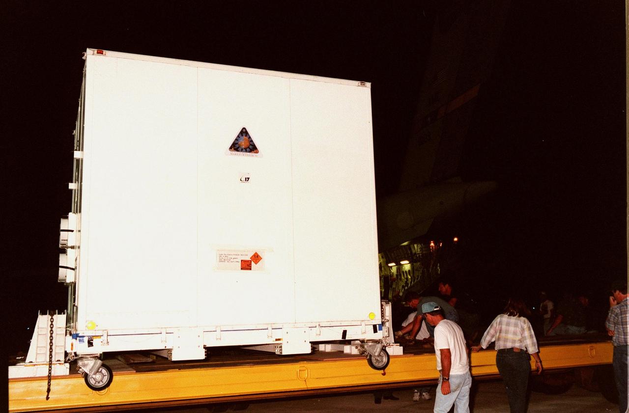KENNEDY SPACE CENTER, FLA. -- At the Shuttle Landing Facility, the Mars Polar Lander is loaded onto a truck after its flight aboard an Air Force C-17 cargo plane that carried it from the Lockheed Martin Astronautics plant in Denver, CO. The lander is being transported to the Spacecraft Assembly and Encapsulation Facility-2(SAEF-2) in the KSC Industrial Area for testing, including a functional test of the science instruments and the basic spacecraft subsystems. The solar-powered spacecraft is designed to touch down on the Martian surface near the northern-most boundary of the south pole in order to study the water cycle there. The lander also will help scientists learn more about climate change and current resources on Mars, studying such things as frost, dust, water vapor and condensates in the Martian atmosphere. The Mars Polar Lander spacecraft is planned for launch from Cape Canaveral Air Station aboard a Delta II rocket on Jan. 3, 1999