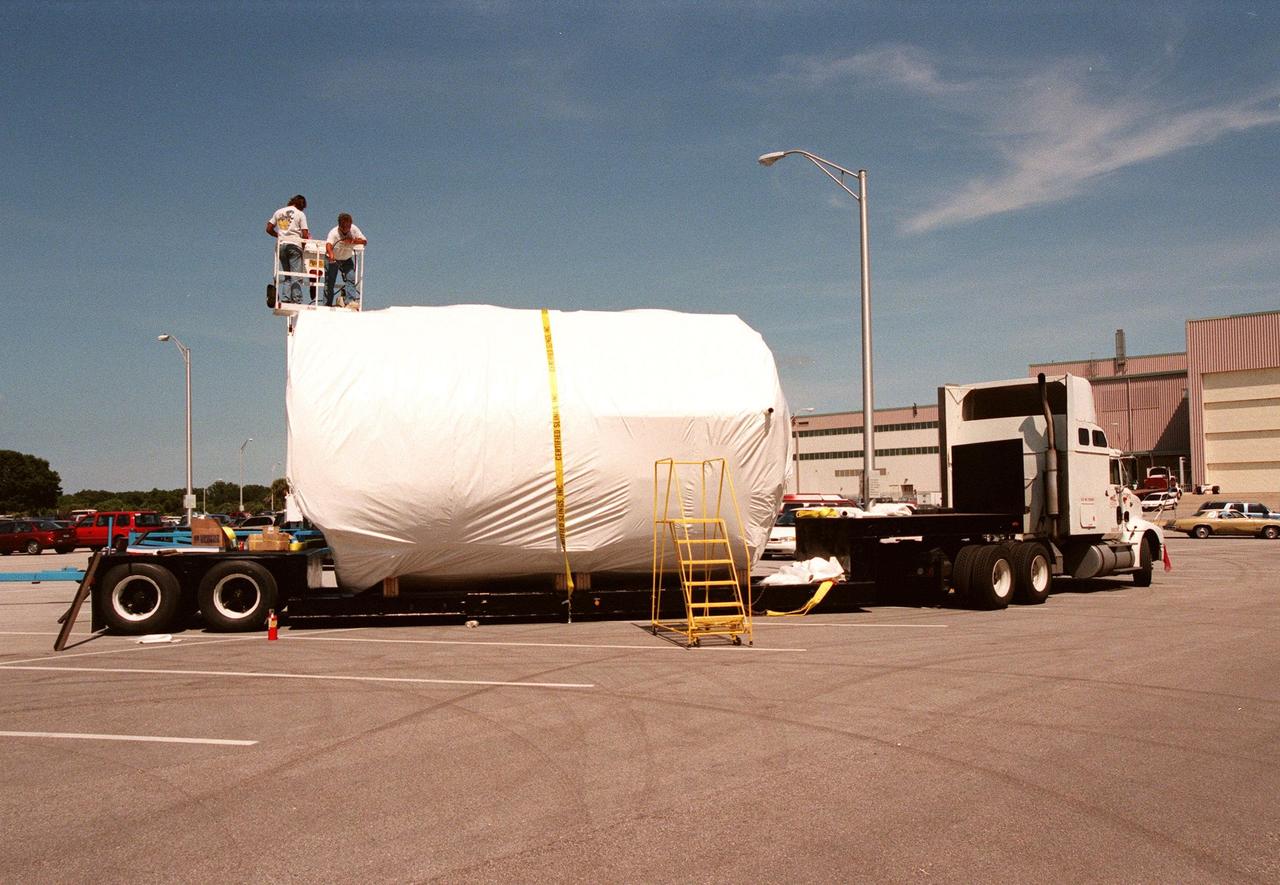 Spacelab is wrapped and ready for transport to the National Air and Space Museum in Washington, DC. Spacelab was designed by the European Space Agency (ESA) for the Space Shuttle program and first flew on STS-9 in November 1983. Its final flight was the STS-90 Neurolab mission in April 1998. A sister module will travel home and be placed on display in Europe. The Spacelab concept of modular experiment racks in a pressurized shirt-sleeve environment made it highly user-friendly and accessible. Numerous experiments conceived by hundreds of scientists on the ground were conducted by flight crews in orbit. Spacelab modules served as on-orbit homes for everything from squirrel monkeys to plant seeds. They supported astronomical as well as Earth observations, for servicing the Hubble Space Telescope and for research preparatory to the International Space Station. One of the greatest benefits afforded by the Spacelab missions was the opportunity to fly a mission more than once, with the second or third flight building on the experiences and data gathered from its predecessors