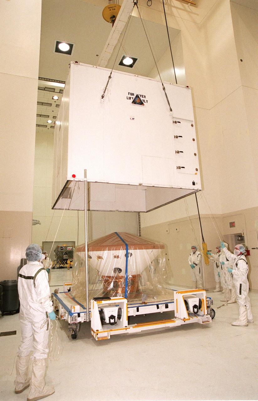 KENNEDY SPACE CENTER, FLA. -- The Mars Polar Lander is uncrated in the Spacecraft Assembly and Encapsulation Facility-2 (SAEF-2). The Mars Polar Lander is targeted for launch from Cape Canaveral Air Station aboard a Delta II rocket on Jan. 3, 1999. The solar-powered spacecraft is designed to touch down on the Martian surface near the northern-most boundary of the south pole in order to study the water cycle there. The lander also will help scientists learn more about climate change and current resources on Mars, studying such things as frost, dust, water vapor and condensates in the Martian atmosphere