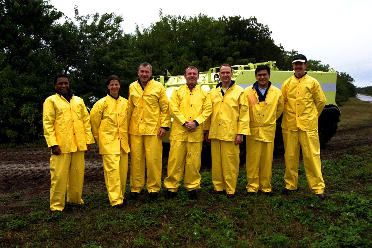 The STS-89 crew pose in front of an M-113 armored personnel carrier while participating in Terminal Countdown Demonstration Test (TCDT) activities. The TCDT is held at KSC prior to each Space Shuttle flight to provide crews with an opportunity to participate in simulated countdown activities. Posing, from left to right, are Mission Specialists Michael Anderson and Bonnie Dunbar, Ph.D.; Commander Terrence Wilcutt; Mission Specialist Andrew Thomas, Ph.D.; Pilot Joe Edwards Jr.; and Mission Specialists Salizhan Sharipov of the Russian Space Agency and James Reilly, Ph.D. The STS-89 mission will be the eighth docking of the Space Shuttle with the Russian Space Station Mir. After docking, Dr. Thomas will transfer to the space station, succeeding David Wolf, M.D., who will return to Earth aboard Endeavour. Dr. Thomas will live and work on Mir until June. STS-89 is scheduled for a Jan. 22 liftoff at 9:48 p.m