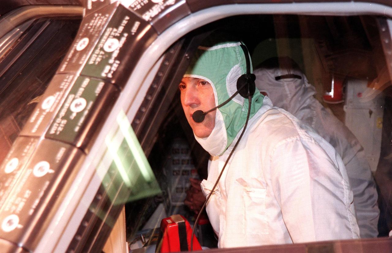 KENNEDY SPACE CENTER, FLA. -- In the Orbiter Processing Facility Bay 1, STS-88 Commander Robert D. Cabana makes a visual inspection of the windows on Space Shuttle orbiter Endeavour. The STS-88 crew members are participating in a Crew Equipment Interface Test (CEIT), familiarizing themselves with the orbiter's midbody and crew compartments. Targeted for liftoff on Dec. 3, 1998, STS-88 will be the first Space Shuttle launch for assembly of the International Space Station (ISS). The primary payload is the Unity connecting module which will be mated to the Russian-built Zarya control module, expected to be already on orbit after a November launch from Russia. The first major U.S.-built component of ISS, Unity will serve as a connecting passageway to living and working areas of the space station. Unity has two attached pressurized mating adapters (PMAs) and one stowage rack installed inside. PMA-1 provides the permanent connection point between Unity and Zarya; PMA-2 will serve as a Space Shuttle docking port. Zarya is a self-supporting active vehicle, providing propulsive control capability and power during the early assembly stages. It also has fuel storage capability