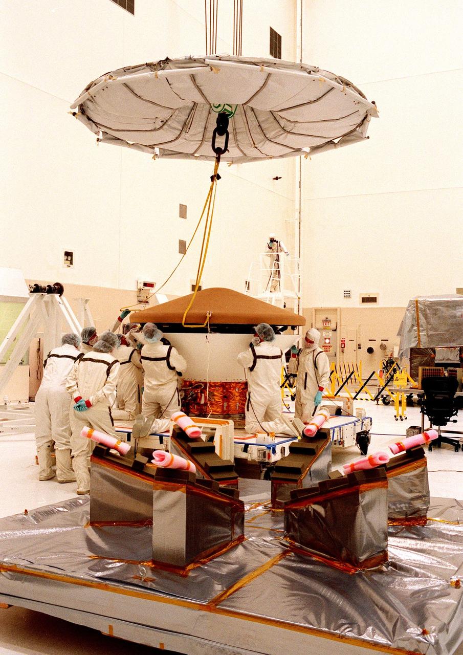 KENNEDY SPACE CENTER, FLA. -- In the Spacecraft Assembly and Encapsulation Facility-2 (SAEF-2), the top of the Mars Polar Lander is removed to prepare the Lander for testing, including a functional test of the science instruments and the basic spacecraft subsystems. The Mars Polar Lander is targeted for launch from Cape Canaveral Air Station aboard a Delta II rocket on Jan. 3, 1999. The solar-powered spacecraft is designed to touch down on the Martian surface near the northern-most boundary of the south pole in order to study the water cycle there. The lander also will help scientists learn more about climate change and current resources on Mars, studying such things as frost, dust, water vapor and condensates in the Martian atmosphere