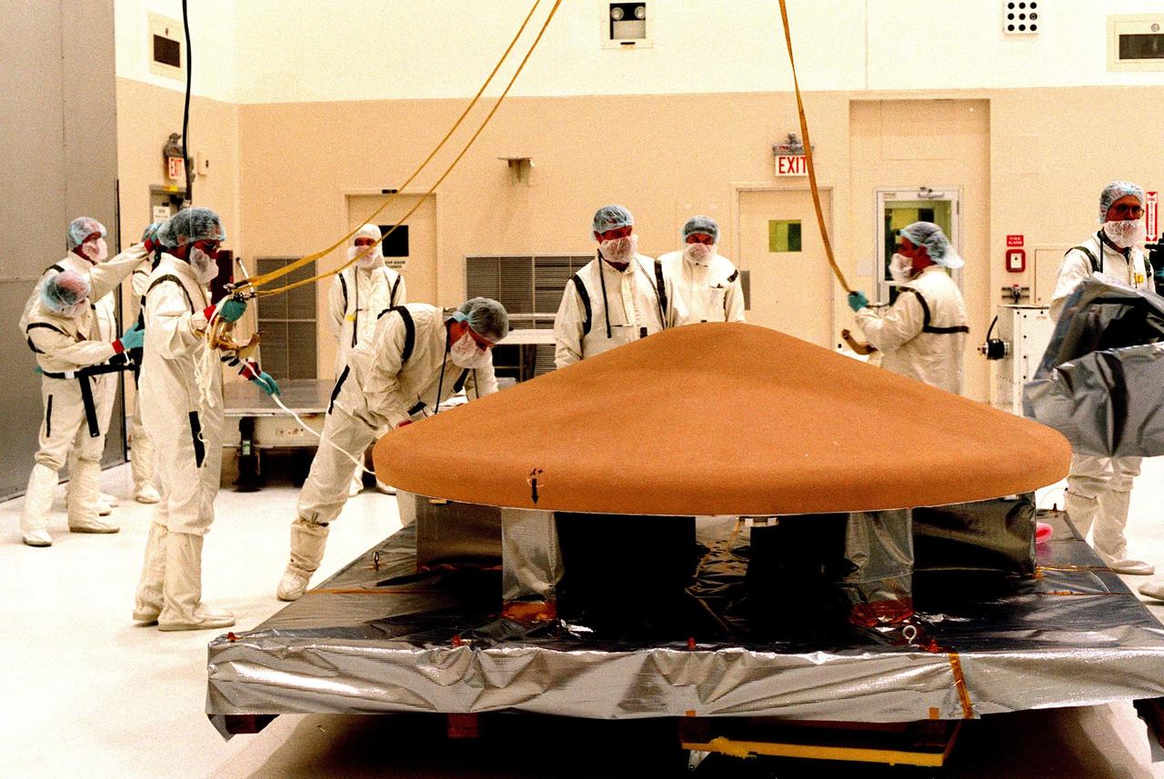KENNEDY SPACE CENTER, FLA. -- In the Spacecraft Assembly and Encapsulation Facility-2 (SAEF-2), the top of the Mars Polar Lander is secured on a portable stand. The Lander will undergo testing, including a functional test of the science instruments and the basic spacecraft subsystems, before its launch from Cape Canaveral Air Station aboard a Delta II rocket on Jan. 3, 1999. The solar-powered spacecraft is designed to touch down on the Martian surface near the northern-most boundary of the south pole in order to study the water cycle there. The lander also will help scientists learn more about climate change and current resources on Mars, studying such things as frost, dust, water vapor and condensates in the Martian atmosphere