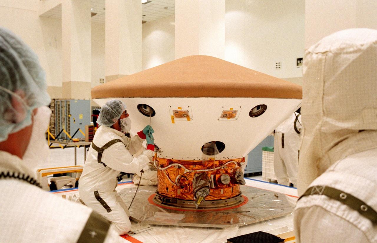KENNEDY SPACE CENTER, FLA. -- In the Spacecraft Assembly and Encapsulation Facility-2 (SAEF-2), a technician begins testing on the Mars Polar Lander. The checkout includes a functional test of the science instruments and the basic spacecraft subsystems. The Mars Polar Lander is targeted for launch from Cape Canaveral Air Station aboard a Delta II rocket on Jan. 3, 1999. The solar-powered spacecraft is designed to touch down on the Martian surface near the northern-most boundary of the south pole in order to study the water cycle there. The lander also will help scientists learn more about climate change and current resources on Mars, studying such things as frost, dust, water vapor and condensates in the Martian atmosphere