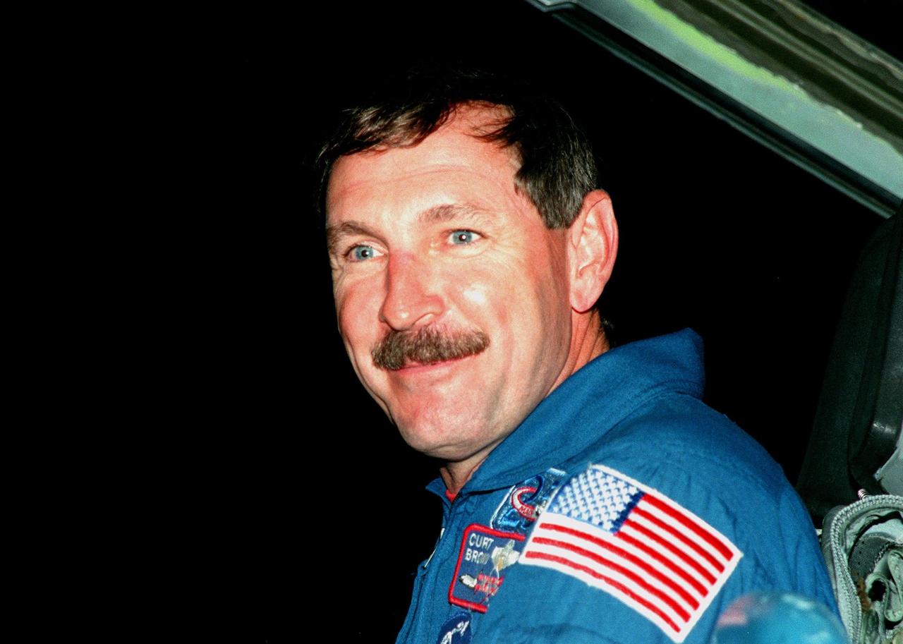 STS-95 Mission Commander Curtis L. Brown arrives aboard a T-38 jet aircraft at the Shuttle Landing Facility at KSC to participate in a Terminal Countdown Demonstration Test (TCDT). Mission launch is scheduled for liftoff on Oct. 29, 1998. The TCDT includes mission familiarization activities, training in emergency exit from the orbiter and launch pad, and a simulated main engine cut-off exercise. Other crew members on the mission are Pilot Steven W. Lindsey; Mission Specialists Scott E. Parazynski, Stephen K. Robinson, and Pedro Duque of Spain, representing the European Space Agency (ESA); and Payload Specialist Chiaki Mukai, representing the National Space Development Agency of Japan (NASDA). The STS-95 mission includes research payloads such as the Spartan solar-observing deployable spacecraft, the Hubble Space Telescope Orbital Systems Test Platform, the International Extreme Ultraviolet Hitchhiker, as well as the SPACEHAB single module with experiments on space flight and the aging process