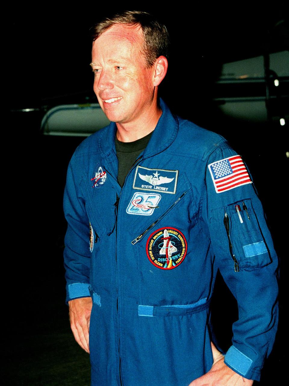 STS-95 Pilot Steven W. Lindsey smiles after his arrival aboard a T-38 jet aircraft at the Shuttle Landing Facility at KSC. The STS-95 crew are at KSC to participate in a Terminal Countdown Demonstration Test (TCDT). The TCDT includes mission familiarization activities, training in emergency exit from the orbiter and launch pad, and a simulated main engine cut-off exercise. The other members on the mission are Mission Commander Curtis L. Brown, Mission Specialists Scott E. Parazynski, Stephen K. Robinson, and Pedro Duque of Spain, representing the European Space Agency (ESA); and Payload Specialists John H. Glenn Jr., senator from Ohio, and Chiaki Mukai, representing the National Space Development Agency of Japan (NASDA). The STS-95 mission, scheduled for liftoff on Oct. 29, includes research payloads such as the Spartan solar-observing deployable spacecraft, the Hubble Space Telescope Orbital Systems Test Platform, the International Extreme Ultraviolet Hitchhiker, as well as the SPACEHAB single module with experiments on space flight and the aging process
