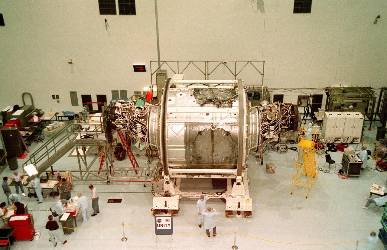 In the Space Station Processing Facility, the Unity connecting module, part of the International Space Station, is shown with Pressurized Mating Adapters 1 (left) and 2 (right) attached. Unity is scheduled to undergo testing of the common berthing mechanism to which other space station elements will dock. Unity is the primary payload on mission STS-88, targeted to launch Dec. 3, 1998. Other testing includes the Pad Demonstration Test to verify the compatibility of the module with the Space Shuttle as well as the ability of the astronauts to send and receive commands to Unity from the flight deck of the orbiter. Unity is expected to be ready for installation into the payload canister on Oct. 25, and transported to Launch Pad 39-A on Oct. 27. The Unity will be mated to the Russian-built Zarya control module which should already be in orbit at that time