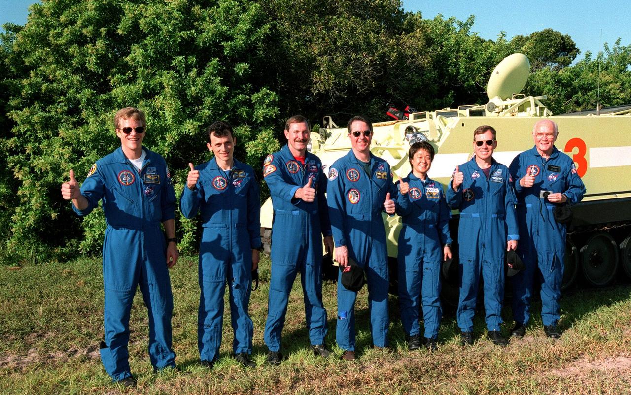 Giving a thumbs up after training on the M-113, a small armored personnel carrier, are STS-95 crew members (left to right) Mission Specialists Scott E. Parazynski and Pedro Duque of Spain, representing the European Space Agency, Mission Commander Curtis L. Brown, Mission Specialist Stephen K. Robinson, Payload Specialist Chiaki Mukai, representing the National Space Development Agency of Japan (NASDA), Pilot Steven W. Lindsey and Payload Specialist John H. Glenn, senator from Ohio. The M-113 is a tracked vehicle that could be used by the crew in the event of an emergency at the pad during which they must make a quick exit from the area. The STS-95 crew is at KSC to participate in a Terminal Countdown Demonstration Test (TCDT) which also includes mission familiarization activities and a simulated main engine cut-off exercise. STS-95, which is targeted for launch on Oct. 29, 1998, includes research payloads such as the Spartan solar-observing deployable spacecraft, the Hubble Space Telescope Orbital Systems Test Platform, the International Extreme Ultraviolet Hitchhiker, as well as the SPACEHAB single module with experiments on space flight and the aging process