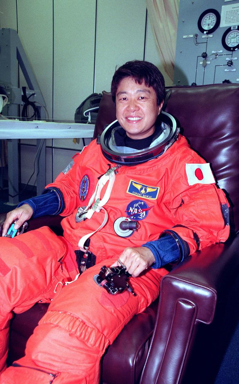 STS-95 Payload Specialist Chiaki Mukai (M.D., Ph.D.), representing the National Space Development Agency of Japan (NASDA), suits up in the Operations and Checkout (O&C) Building prior to her trip to Launch Pad 39-B. Mukai and the rest of the STS-95 crew are at KSC to participate in the Terminal Countdown Demonstration Test (TCDT) which includes mission familiarization activities, emergency egress training, and a simulated main engine cutoff. The other crew members are Pilot Steven W. Lindsey, Mission Specialist Scott E. Parazynski, Mission Specialist Stephen K. Robinson, Mission Specialist Pedro Duque of Spain, representing the European Space Agency (ESA), Payload Specialist John H. Glenn Jr., senator from Ohio, and Mission Commander Curtis L. Brown. The STS-95 mission, targeted for liftoff on Oct. 29, includes research payloads such as the Spartan solar-observing deployable spacecraft, the Hubble Space Telescope Orbital Systems Test Platform, the International Extreme Ultraviolet Hitchhiker, as well as the SPACEHAB single module with experiments on space flight and the aging process. Following the TCDT, the crew will be returning to Houston for final flight preparations