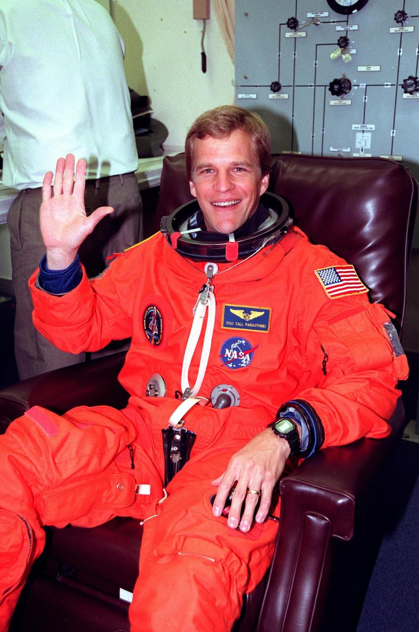 STS-95 Mission Specialist Scott E. Parazynski suits up in the Operations and Checkout Building prior to his trip to Launch Pad 39-B. Parazynski and the rest of the STS-95 crew are at KSC to participate in the Terminal Countdown Demonstration Test (TCDT) which includes mission familiarization activities, emergency egress training, and a simulated main engine cutoff. The other crew members are Payload Specialist Chiaki Mukai (M.D., Ph.D.), representing the National Space Development Agency of Japan (NASDA), Pilot Steven W. Lindsey, Mission Specialist Stephen K. Robinson, Mission Specialist Pedro Duque of Spain, representing the European Space Agency (ESA), Payload Specialist John H. Glenn Jr., senator from Ohio, and Mission Commander Curtis L. Brown. The STS-95 mission, targeted for liftoff on Oct. 29, includes research payloads such as the Spartan solar-observing deployable spacecraft, the Hubble Space Telescope Orbital Systems Test Platform, the International Extreme Ultraviolet Hitchhiker, as well as the SPACEHAB single module with experiments on space flight and the aging process. Following the TCDT, the crew will be returning to Houston for final flight preparations