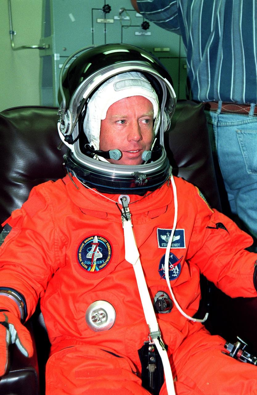 STS-95 Pilot Steven W. Lindsey suits up in the Operations and Checkout Building prior to his trip to Launch Pad 39-B. Lindsey and the rest of the STS-95 crew are at KSC to participate in the Terminal Countdown Demonstration Test (TCDT) which includes mission familiarization activities, emergency egress training, and a simulated main engine cutoff. The other crew members are Payload Specialist Chiaki Mukai (M.D., Ph.D.), representing the National Space Development Agency of Japan (NASDA), Mission Specialist Scott E. Parazynski, Mission Specialist Stephen K. Robinson, Mission Specialist Pedro Duque of Spain, representing the European Space Agency (ESA), Payload Specialist John H. Glenn Jr., senator from Ohio, and Mission Commander Curtis L. Brown. The STS-95 mission, targeted for liftoff on Oct. 29, includes research payloads such as the Spartan solar-observing deployable spacecraft, the Hubble Space Telescope Orbital Systems Test Platform, the International Extreme Ultraviolet Hitchhiker, as well as the SPACEHAB single module with experiments on space flight and the aging process. Following the TCDT, the crew will be returning to Houston for final flight preparations