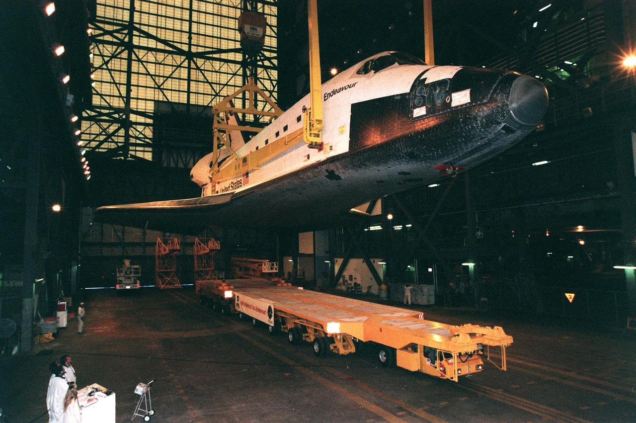 KENNEDY SPACE CENTER, FLA. -- Orbiter Endeavour is lifted off the transporter to raise it to a vertical position inside the Vehicle Assembly Building where it will be mated with the solid rocket boosters and external tank. Endeavour is scheduled to fly on mission STS-88, the first flight for the International Space Station, on Dec. 3, 1998. The primary payload on the mission is the Unity connecting module, which will be mated to the Russian-built Zarya control module expected to already be in orbit at that time