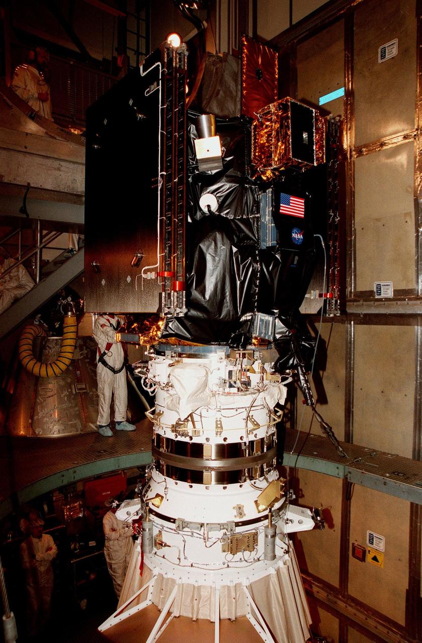 KENNEDY SPACE CENTER, FLA. -- On Launch Pad 17A at Cape Canaveral Air Station, released from its protective payload transportation container, Deep Space 1 waits to have the fairing attached before launch. Targeted for launch aboard a Boeing Delta 7326 rocket on Oct. 25, Deep Space 1 is the first flight in NASA's New Millennium Program, and is designed to validate 12 new technologies for scientific space missions of the next century, including the engine. Propelled by the gas xenon, the engine is being flight-tested for future deep space and Earth-orbiting missions. Deceptively powerful, the ion drive emits only an eerie blue glow as ionized atoms of xenon are pushed out of the engine. While slow to pick up speed, over the long haul it can deliver 10 times as much thrust per pound of fuel as liquid or solid fuel rockets. Other onboard experiments include software that tracks celestial bodies so the spacecraft can make its own navigation decisions without the intervention of ground controllers. Deep Space 1 will complete most of its mission objectives within the first two months, but will also do a flyby of a near-Earth asteroid, 1992 KD, in July 1999