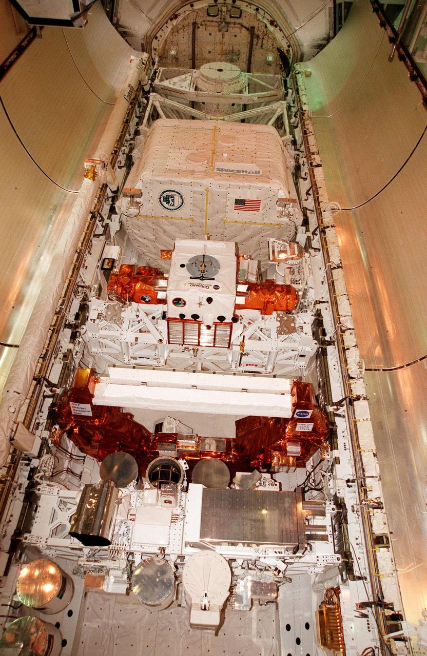 KENNEDY SPACE CENTER, FLA. -- On Launch Complex 39B, the payload bay doors on the orbiter Discovery, scheduled to launch mission STS-95, are poised for closure. The mission includes the SPACEHAB single module (seen at the top of the bay) with experiments on space flight and the aging process, the International Extreme Ultraviolet Hitchhiker (IEH-3), the Hubble Space Telescope Orbital Systems Test Platform, and the Spartan solar-observing deployable spacecraft. STS-95 is expected to launch at 2 p.m. EST on Oct. 29, last 8 days, 21 hours and 49 minutes, and land at 11:49 a.m. EST on Nov. 7