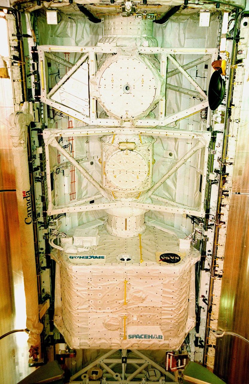 KENNEDY SPACE CENTER, FLA. -- On Launch Complex 39B, the open payload bay doors on the orbiter Discovery reveal the SPACEHAB single module, one of the payloads for mission STS-95. SPACEHAB contains experiments on space flight and the aging process. Other payloads to be added include the International Extreme Ultraviolet Hitchhiker (IEH-3), the Hubble Space Telescope Orbital Systems Test Platform, and the Spartan solar-observing deployable spacecraft. STS-95 is expected to launch at 2 p.m. EST on Oct. 29, last 8 days, 21 hours and 49 minutes, and land at 11:49 a.m. EST on Nov. 7