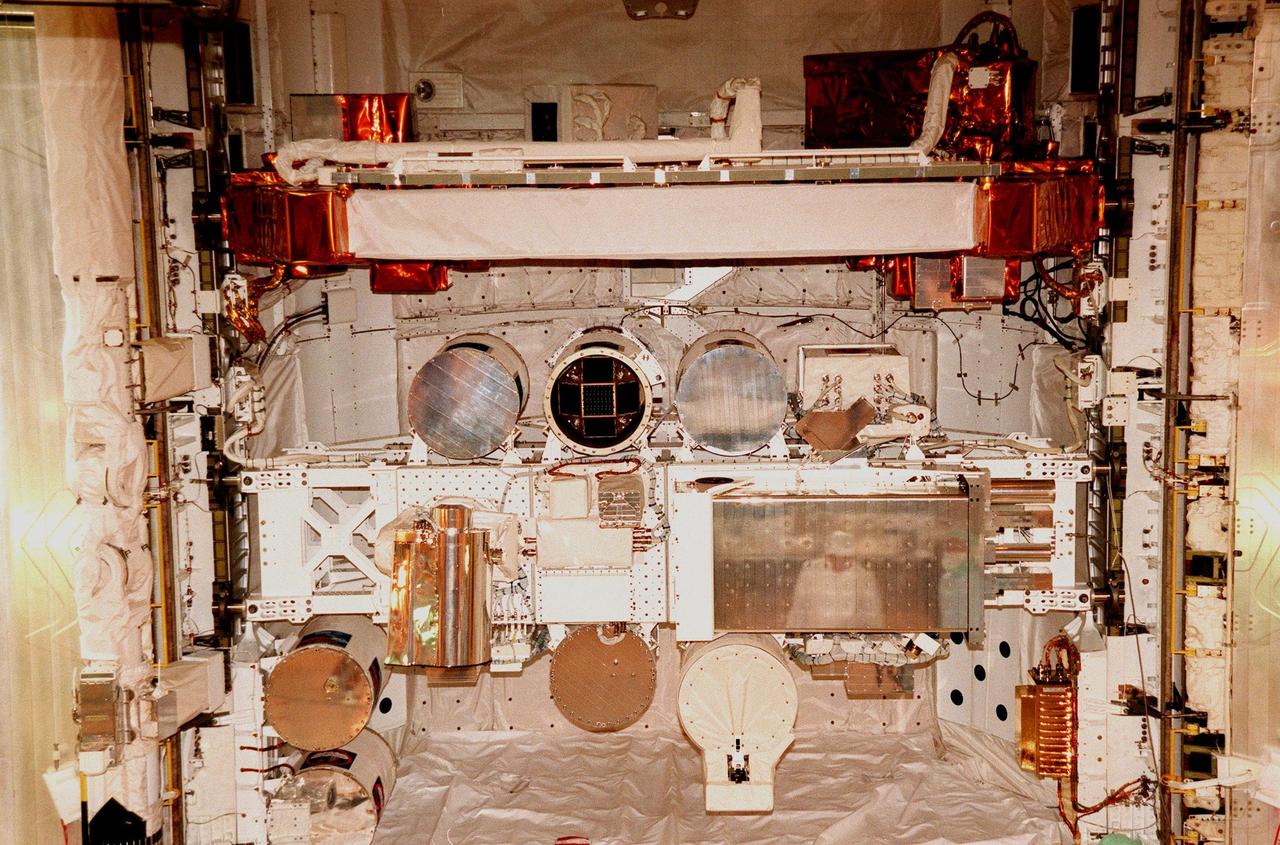 KENNEDY SPACE CENTER, FLA. -- On Launch Complex 39B, the open payload bay doors on the orbiter Discovery reveal (bottom) International Extreme Ultraviolet Hitchhiker (IEH-3) and (above it) Hubble Space Telescope Orbital Systems Test Platform (HOST), two of the payloads for mission STS-95. The other payloads include the Spartan solar-observing deployable spacecraft and SPACEHAB, a single module containing experiments on space flight and the aging process. STS-95 is expected to launch at 2 p.m. EST on Oct. 29, last 8 days, 21 hours and 49 minutes, and land at 11:49 a.m. EST on Nov. 7